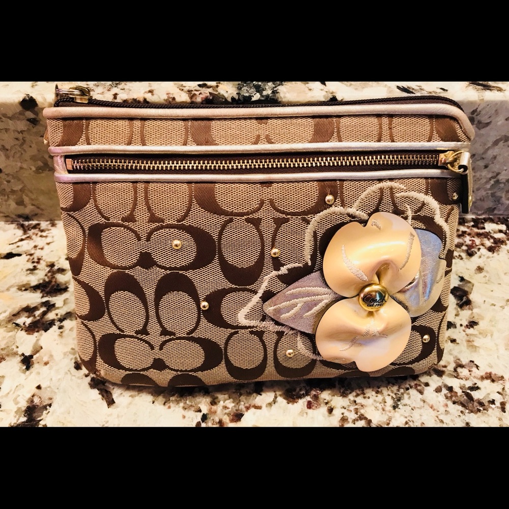 Coach brown signature wristlet with gold flower
